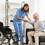 cropped-long-shot-nurse-helping-old-man-getting-up-scaled-3.jpg