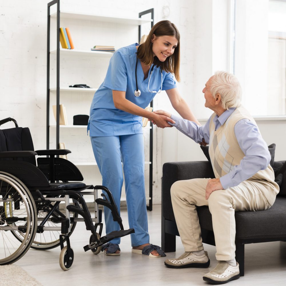 long-shot-nurse-helping-old-man-getting-up